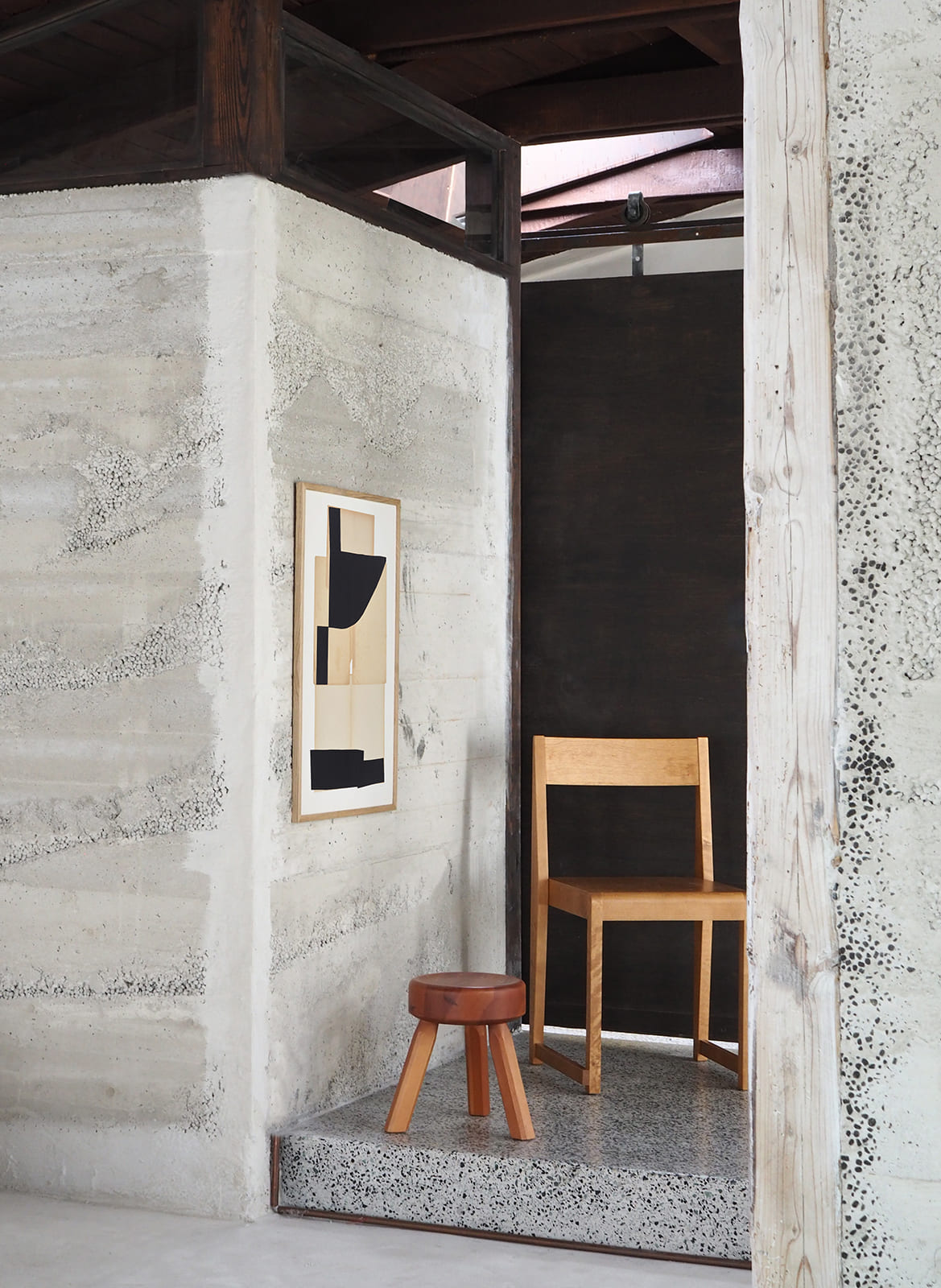 Framed minimalistic poster hanging in a living room by Atelier Cph