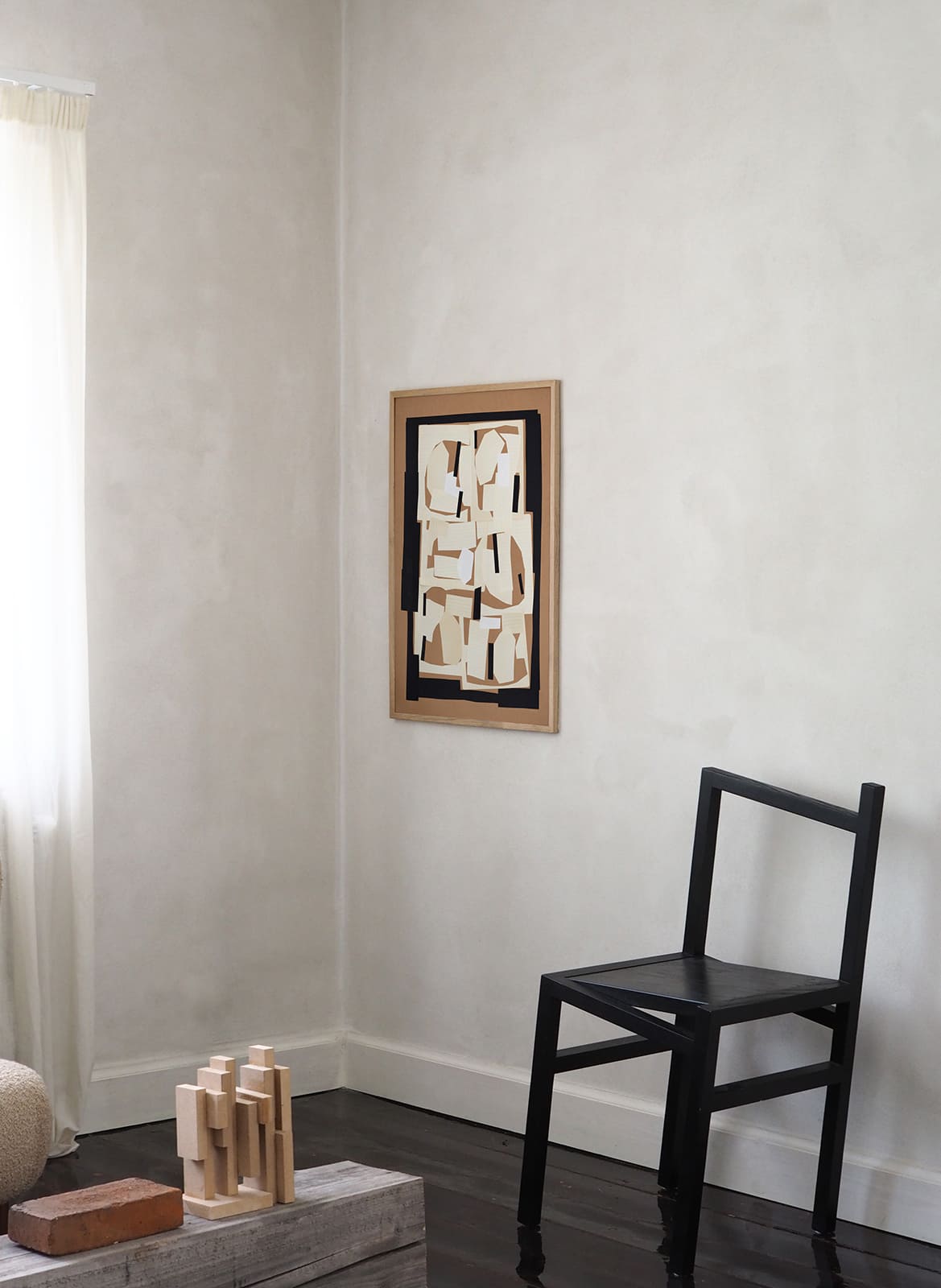 Framed minimalistic poster hanging in a living room by Atelier Cph