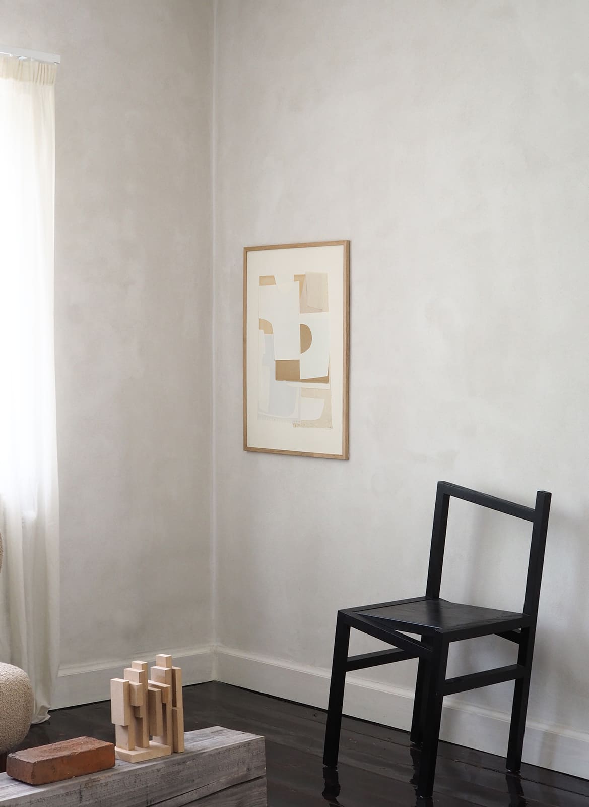 Framed minimalistic poster hanging in a living room by Atelier Cph