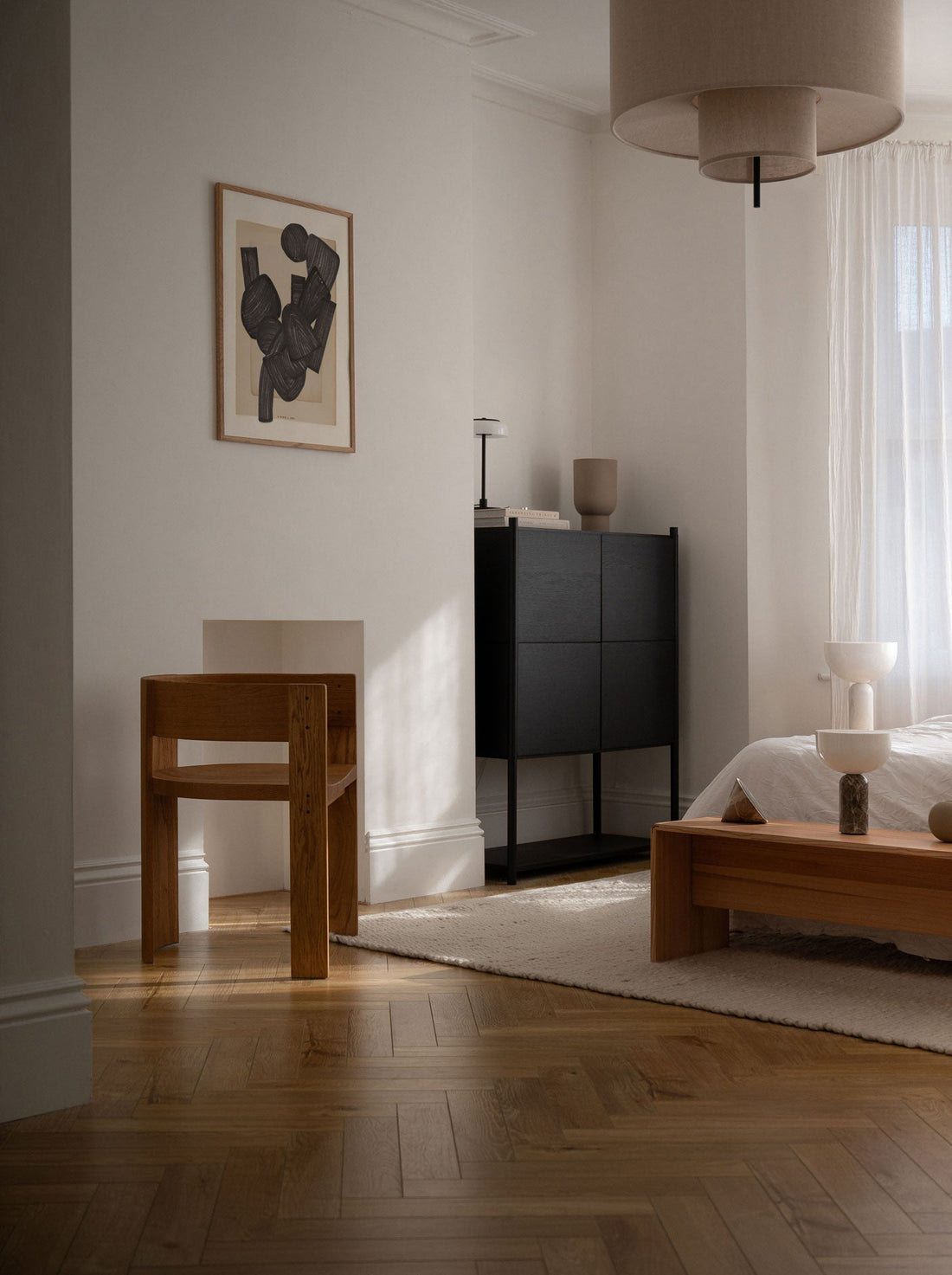 Scandinavian graphic art print hanging on wall in modern apartment
