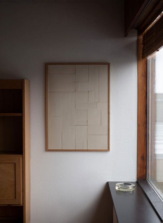 Scandinavian graphic art print hanging on wall in modern architechture