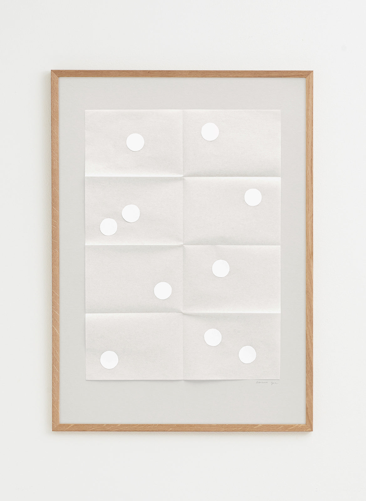 Framed artwork with circular patterns on a white background