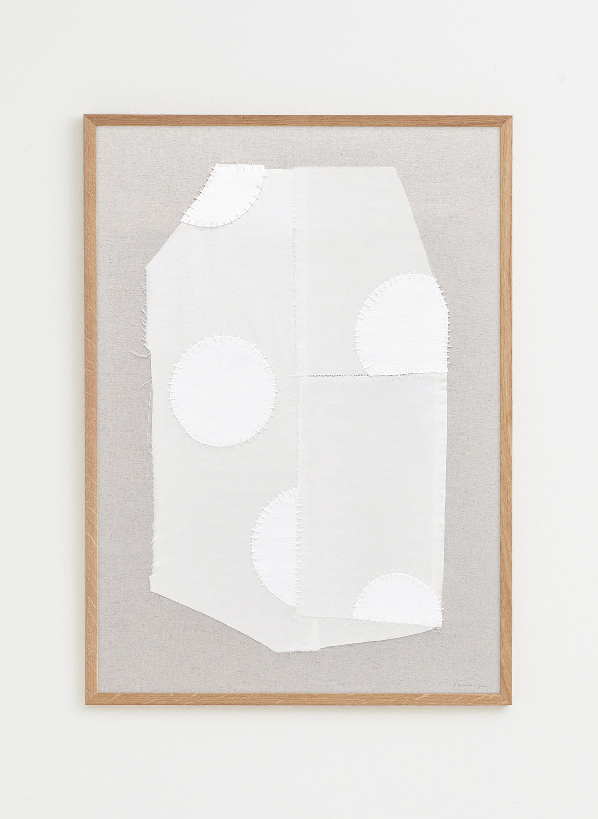 Framed abstract artwork with a white silhouette on a gray background