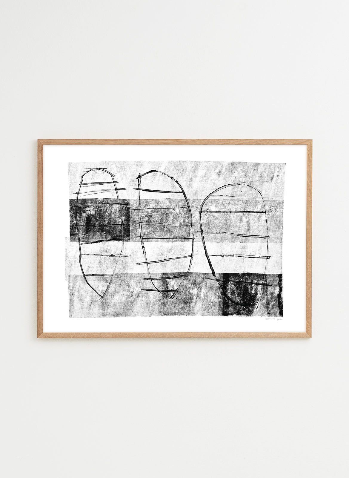 Framed abstract art print with black and white design