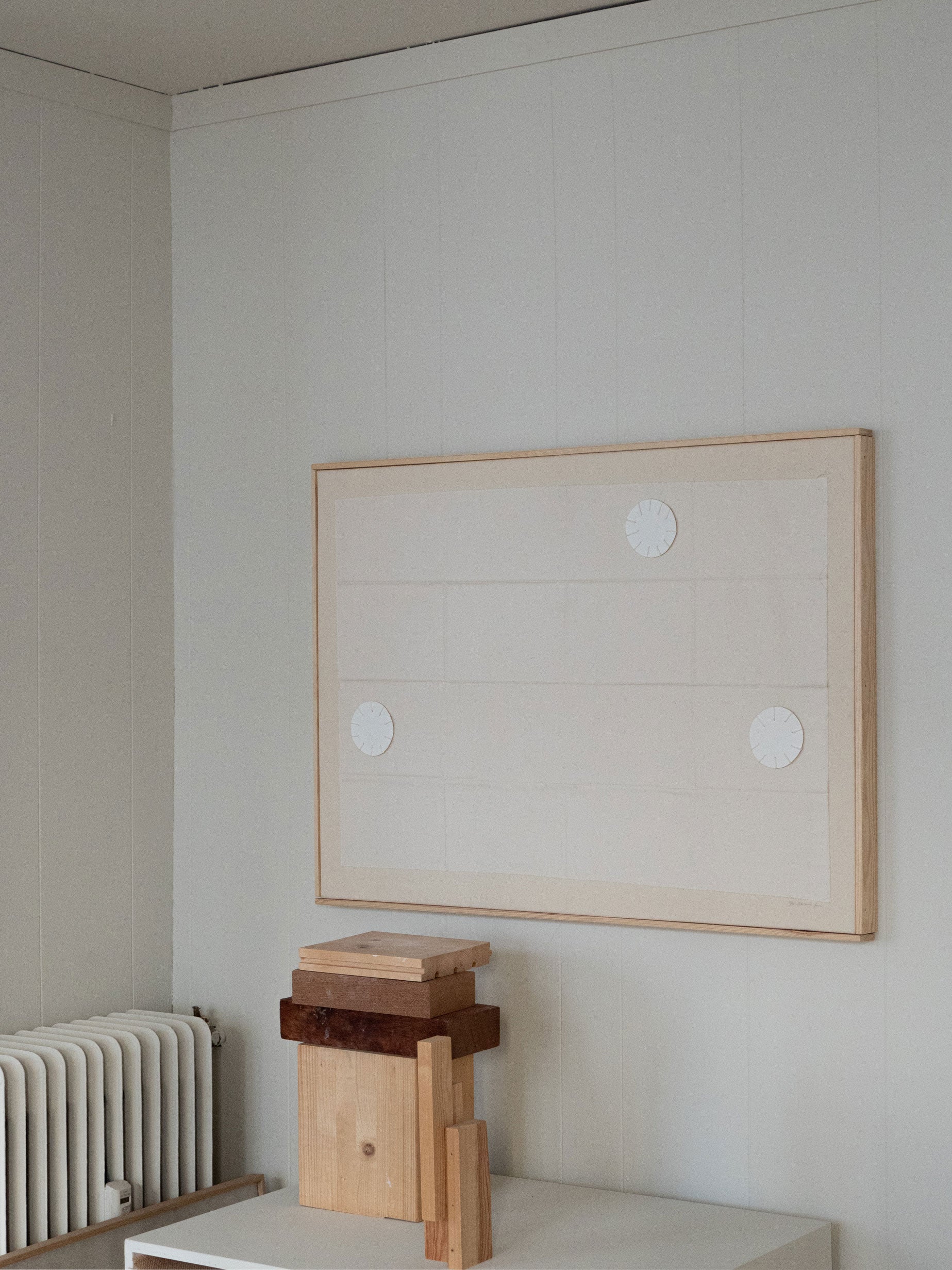 Minimalist textile artwork with stitched white circles on a sand-coloured fabric background, framed in oak, created as a limited edition by Atelier Cph