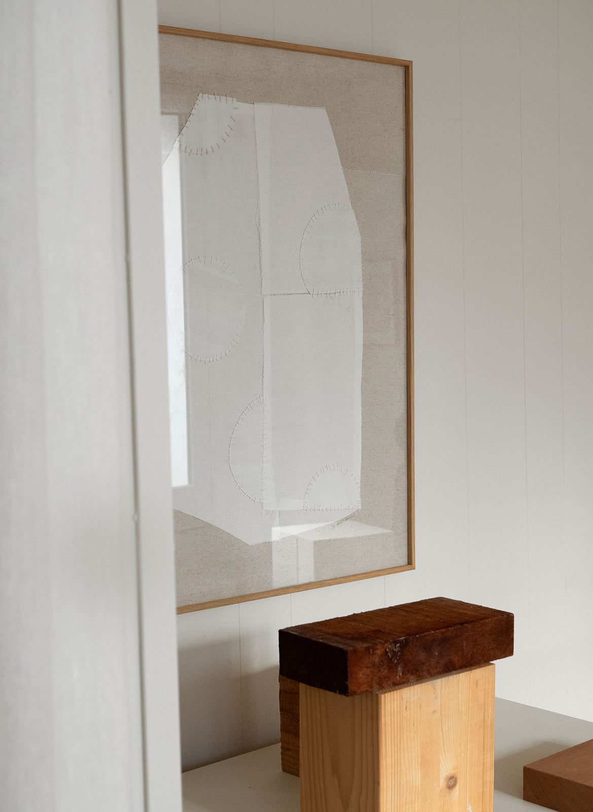  Art pieces by by Atelier Cph withb wooden cubes in front