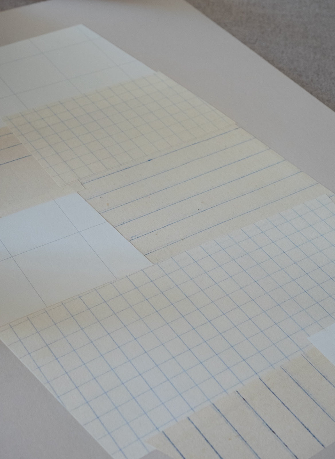 details of art print with paper grid lines on a plain background