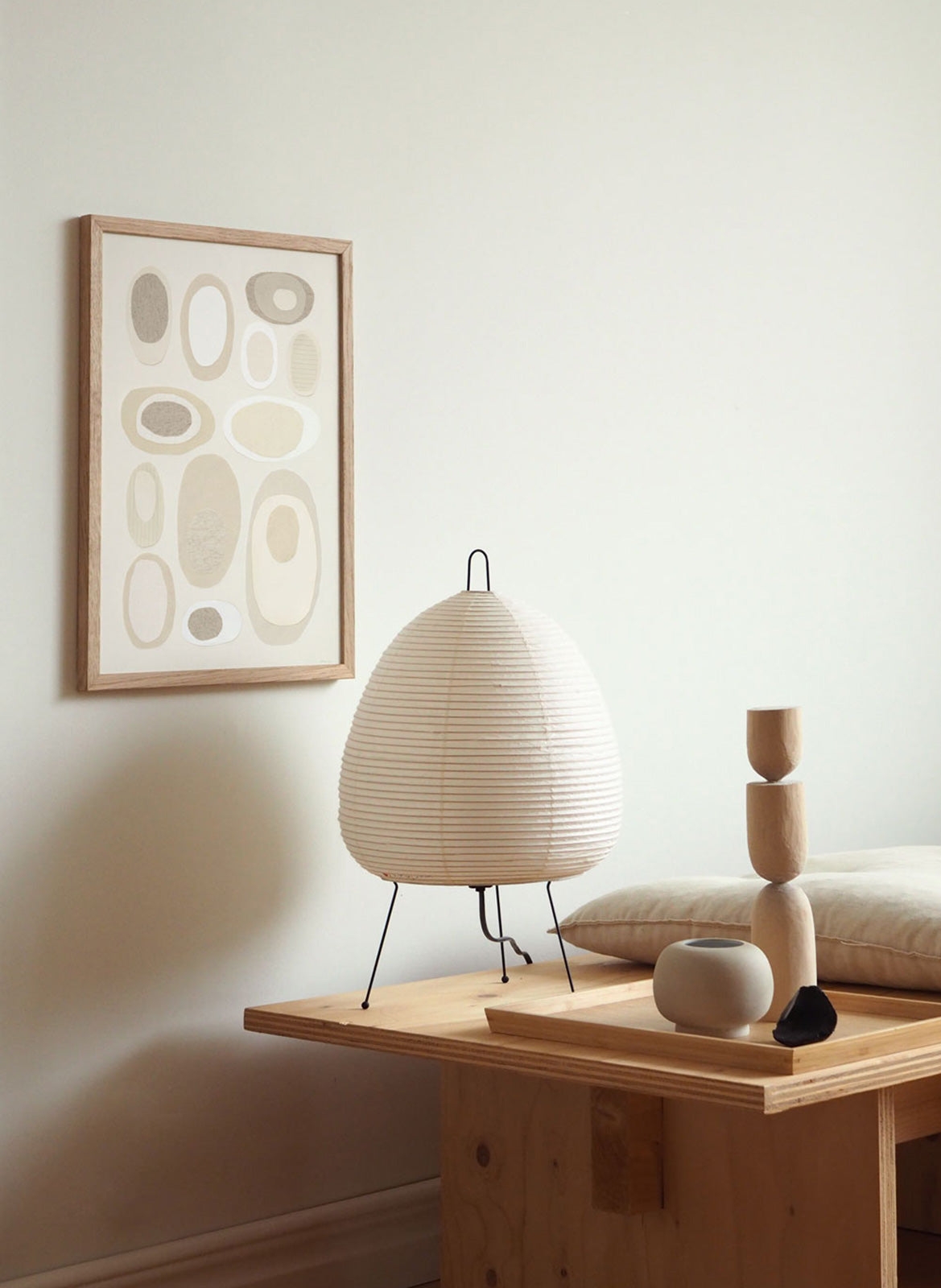 Framed minimalistic poster hanging in a living room by Atelier Cph