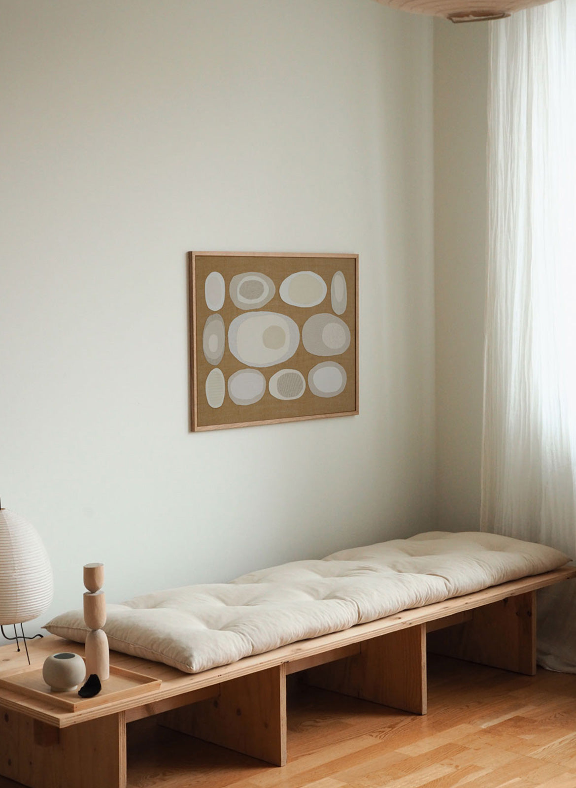 Framed minimalistic poster hanging in a living room by Atelier Cph