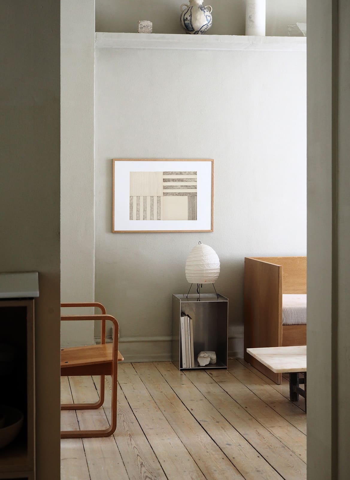  Framed minimalistic poster hanging in a living room by Atelier Cph