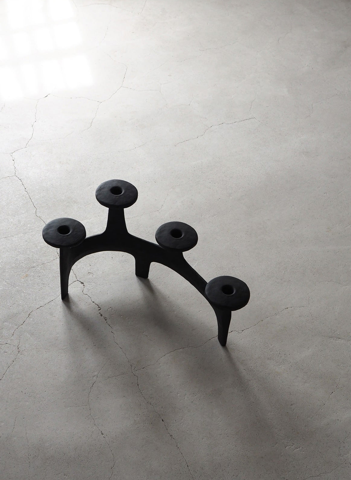 Black sculptural iron candelabra by Anderssen & Voll