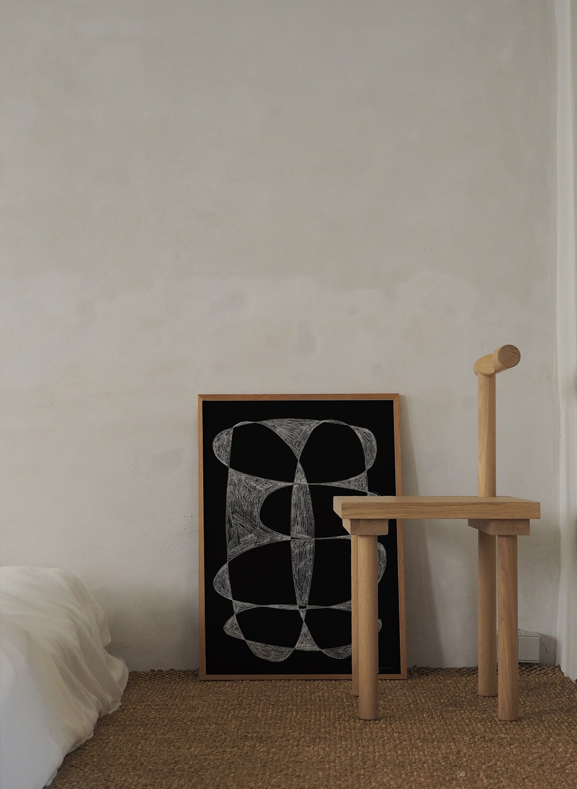 Framed minimalistic poster standing in bedroom by Atelier Cph