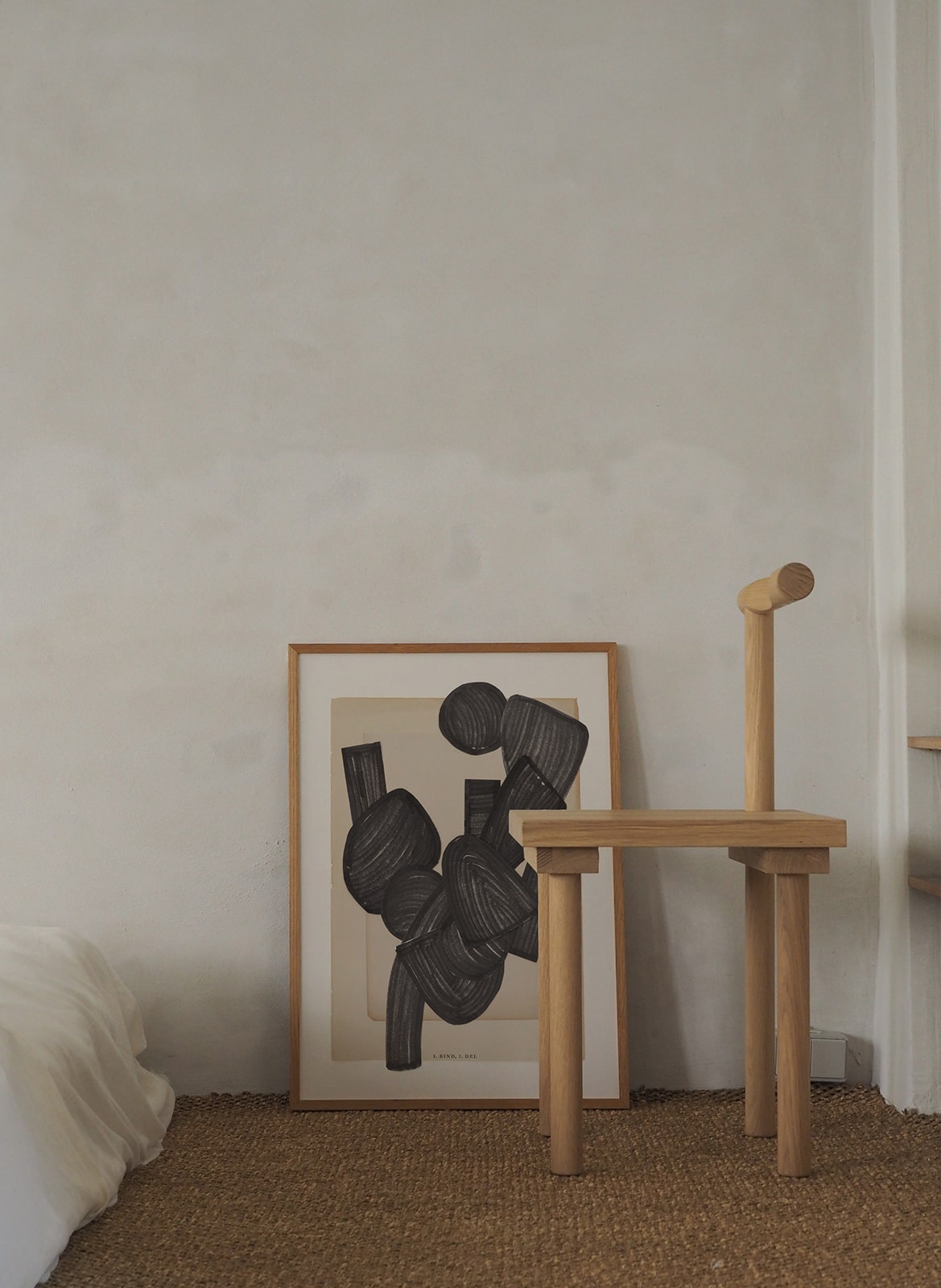  Framed minimalistic poster with graphic elements standing in bedroom by Atelier Cph