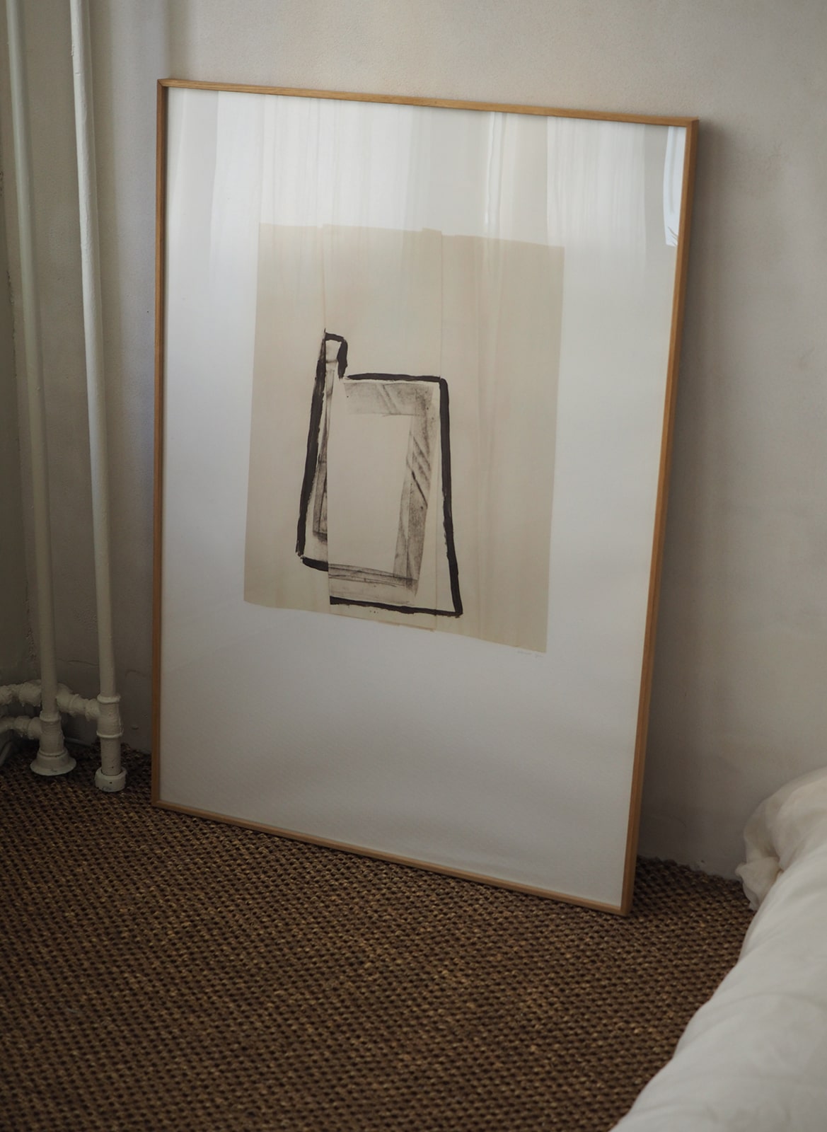  Framed minimalistic poster standing in bedroom by Atelier Cph