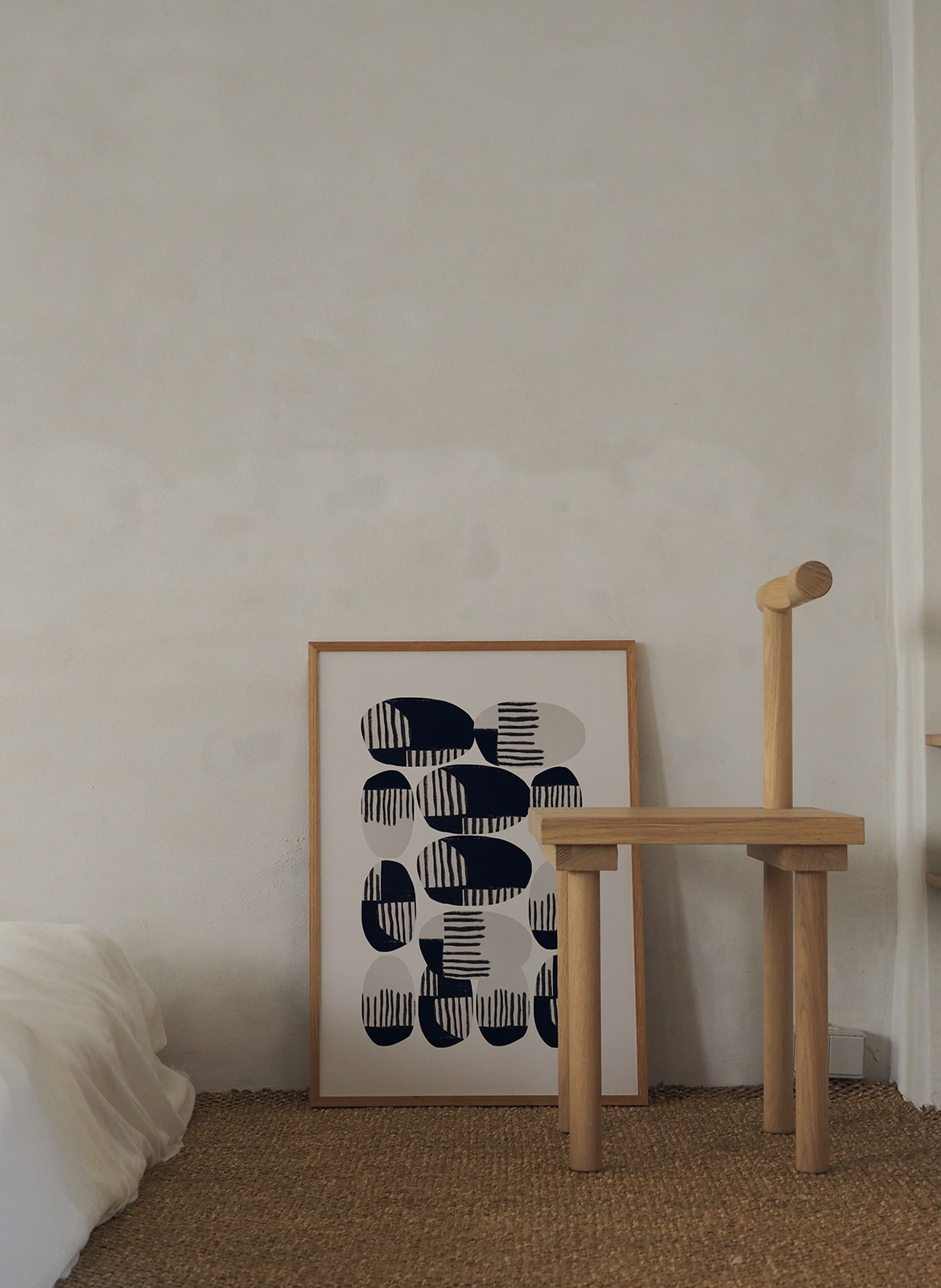  Framed minimalistic poster standing in bedroom by Atelier Cph