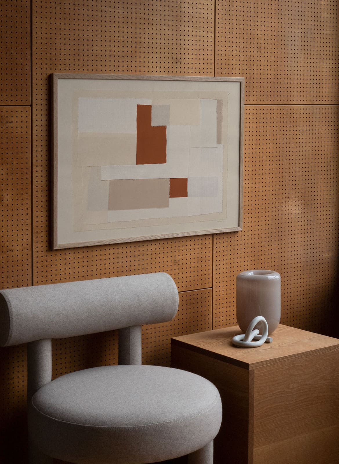 Framed beige poster hanging in a living room by Atelier Cph