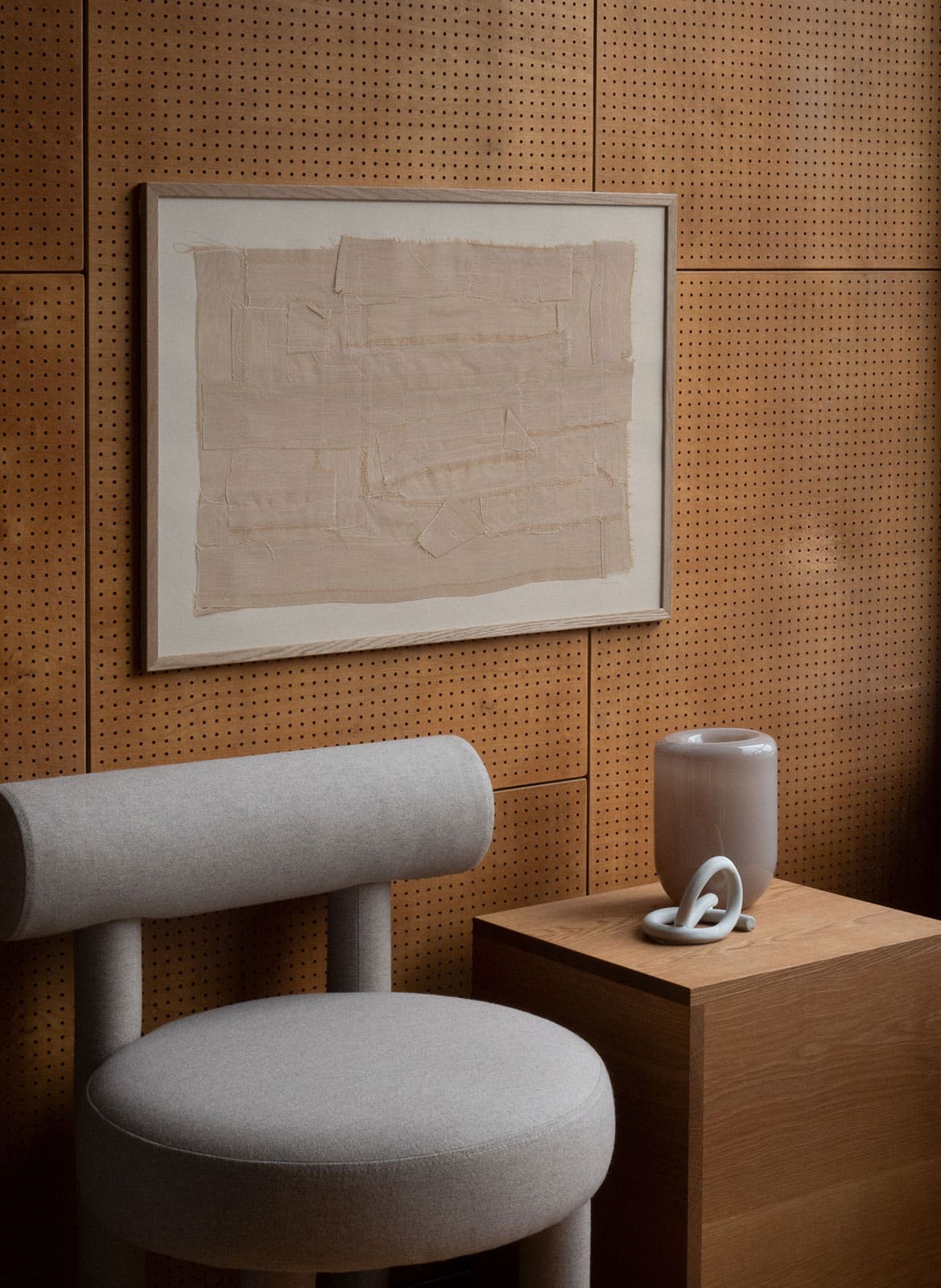 Beige minimalistic poster hanging in a living room by atelier cph