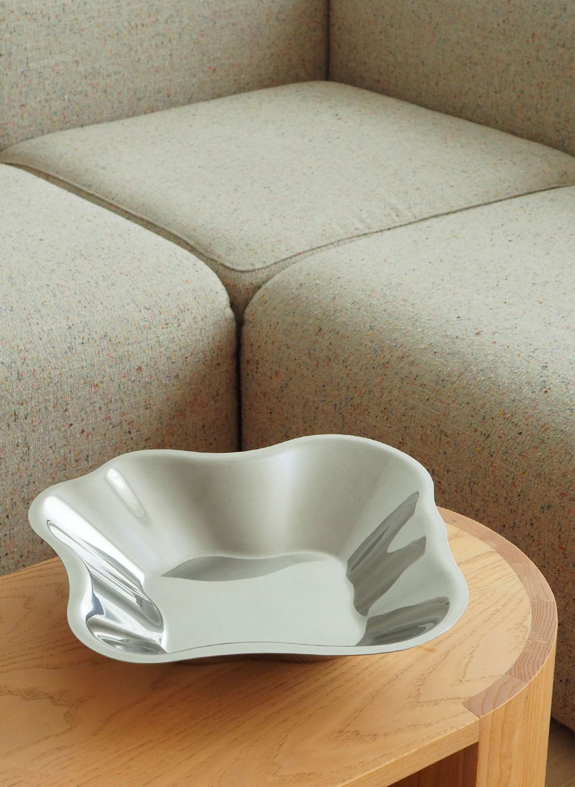 silver Alvar Aalto bowl from Iittala standing on a table